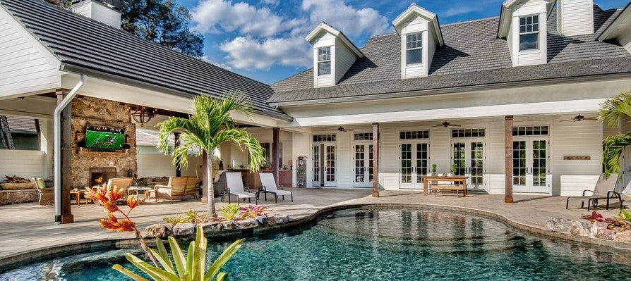 Hampton Road backyard with pool, tropical landscaping, and outdoor living