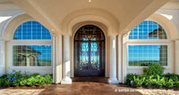 custom front door on a luxury Mediterranean styled house